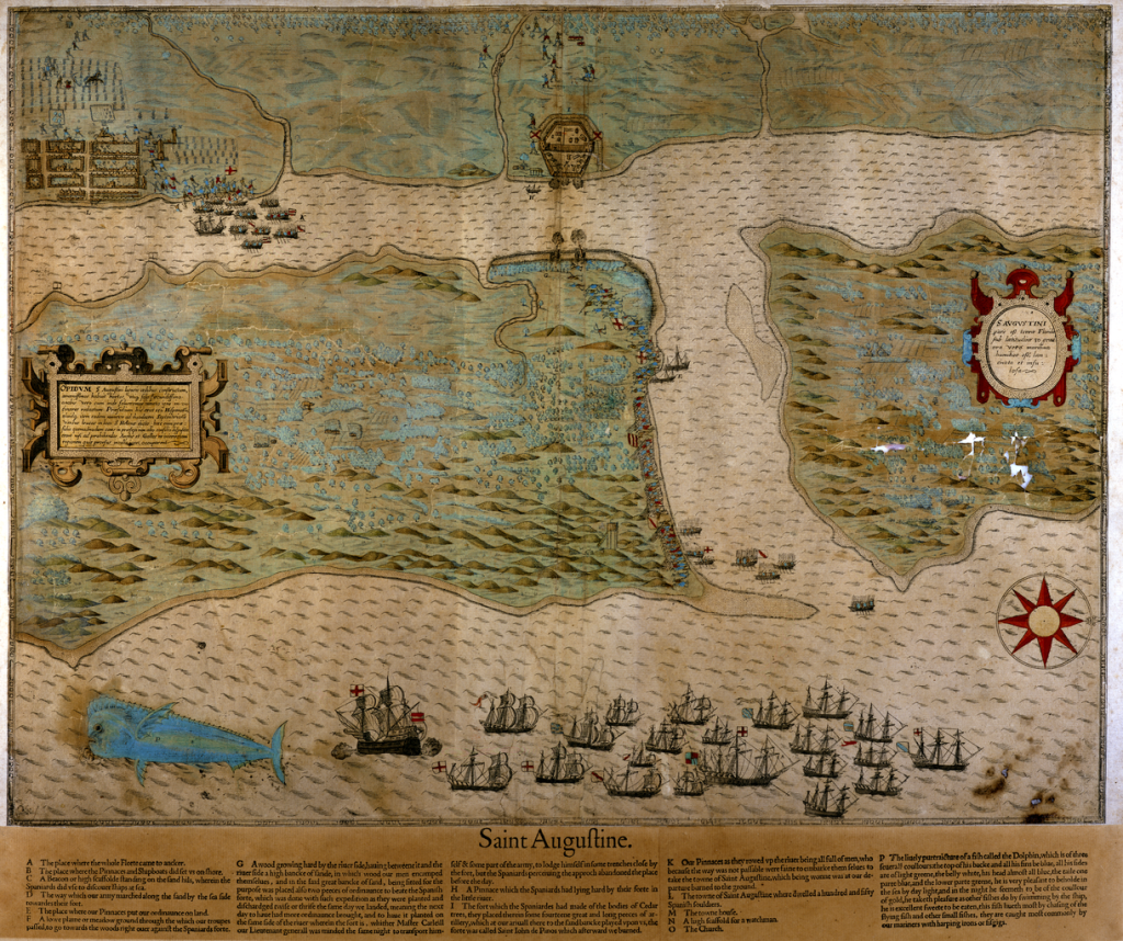 An old painted map showing Anastasia Island and St. Augustine under attack from Sir Francis Drake's fleet. A giant blue fish in the Atlantic Ocean can be seen in the lower left corner of the map. A wooden fort stands where present-day Castillo de San Marcos is.