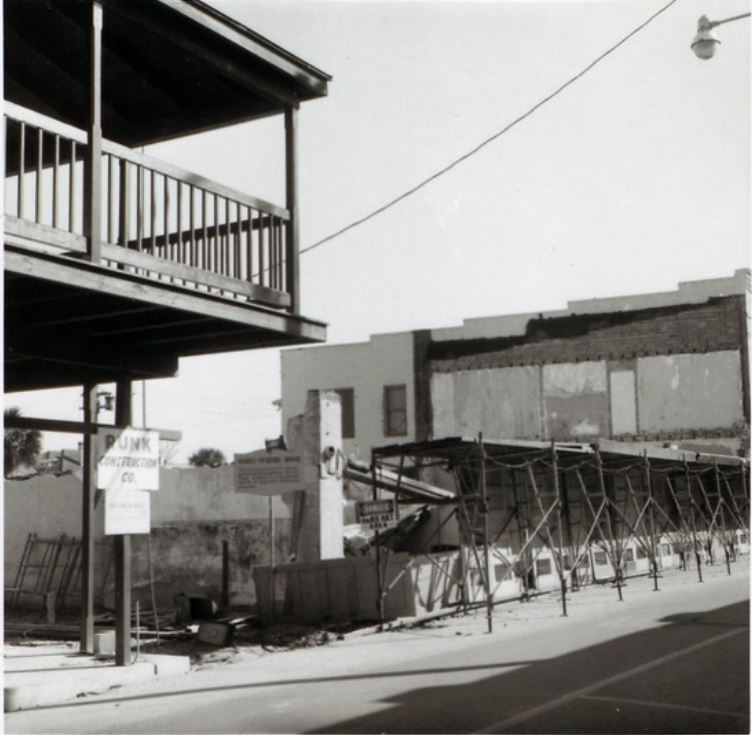 A black and white photograph featuring the construction of the Marin-Hassett House seen from the street.
